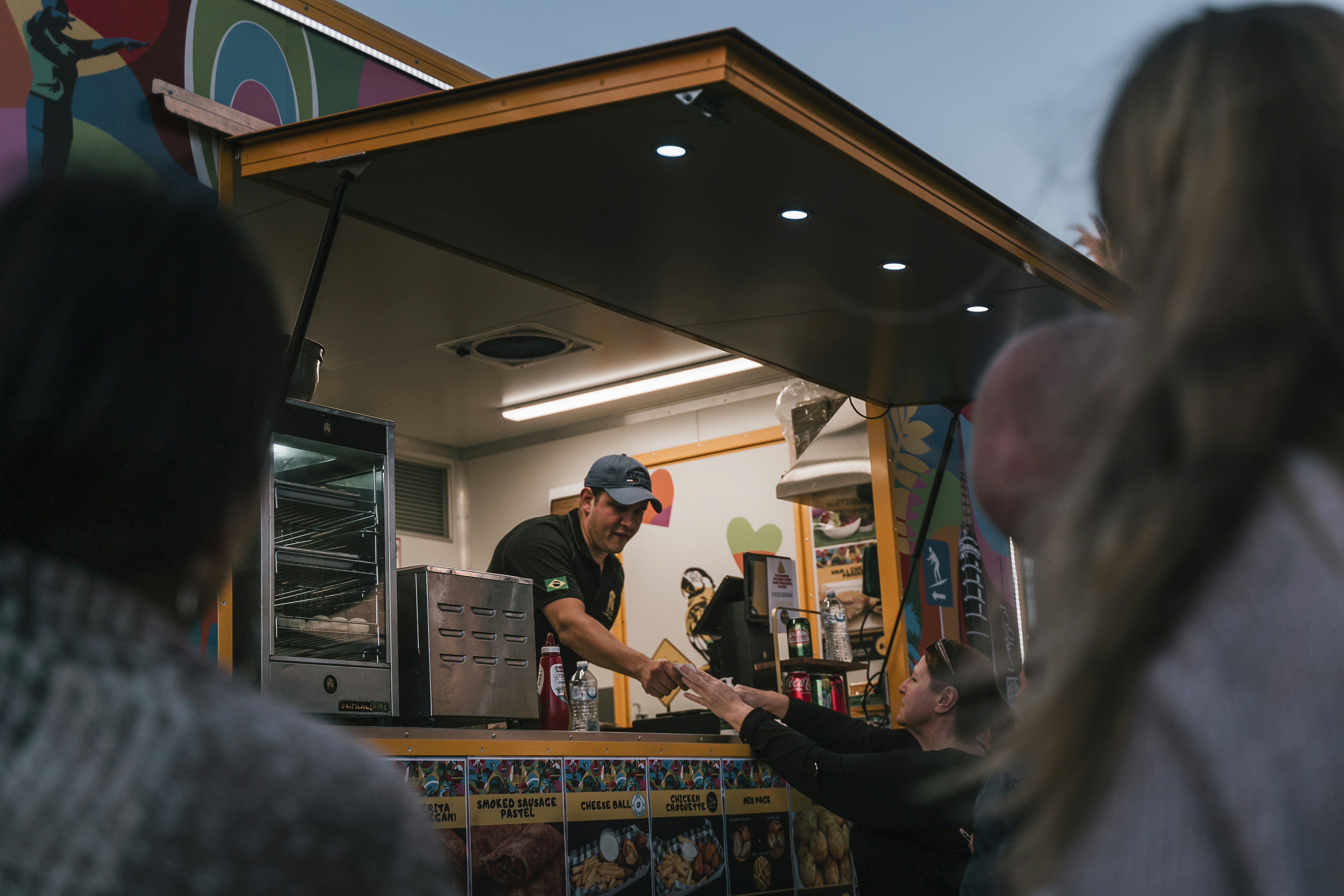 Food truck owner serving customers — illustrating North Dakota LLC Operating Agreement.