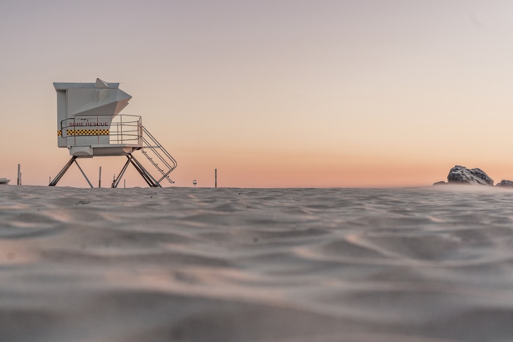 a lifeguard tower in the middle of the ocean