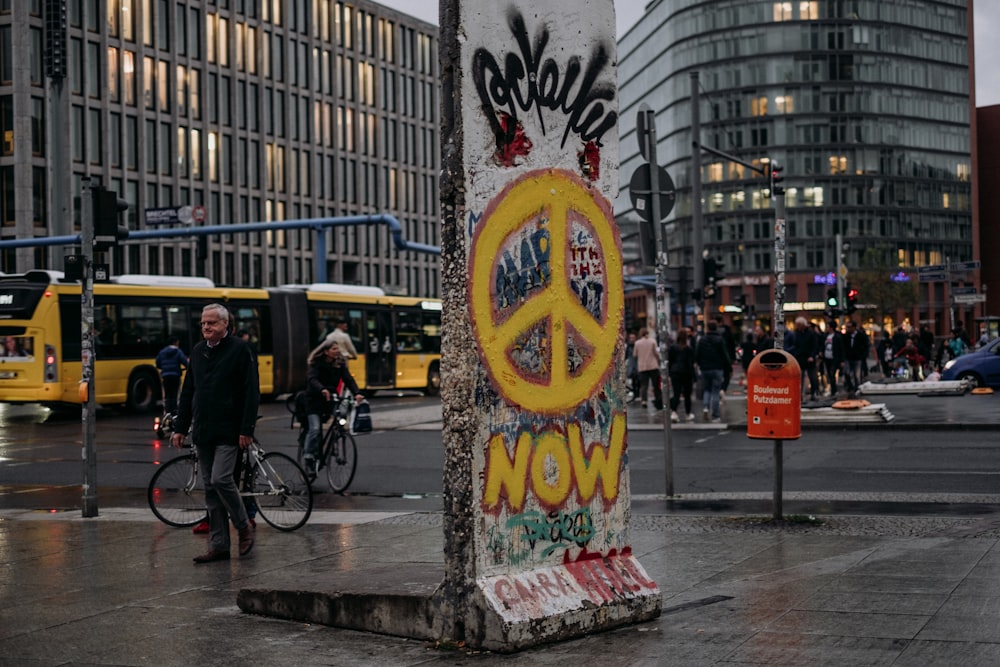 a pole with a peace sign painted on it
