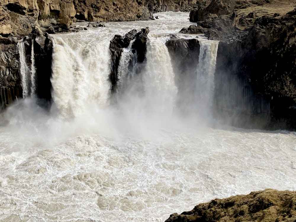 a large waterfall with lots of water coming out of it