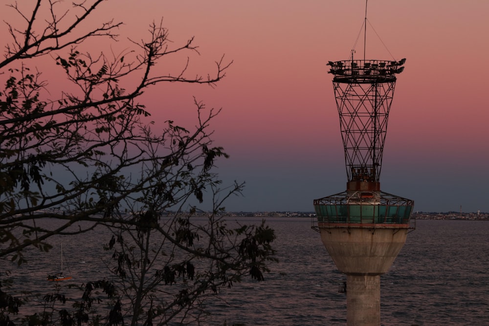 a tower sitting on top of a large body of water