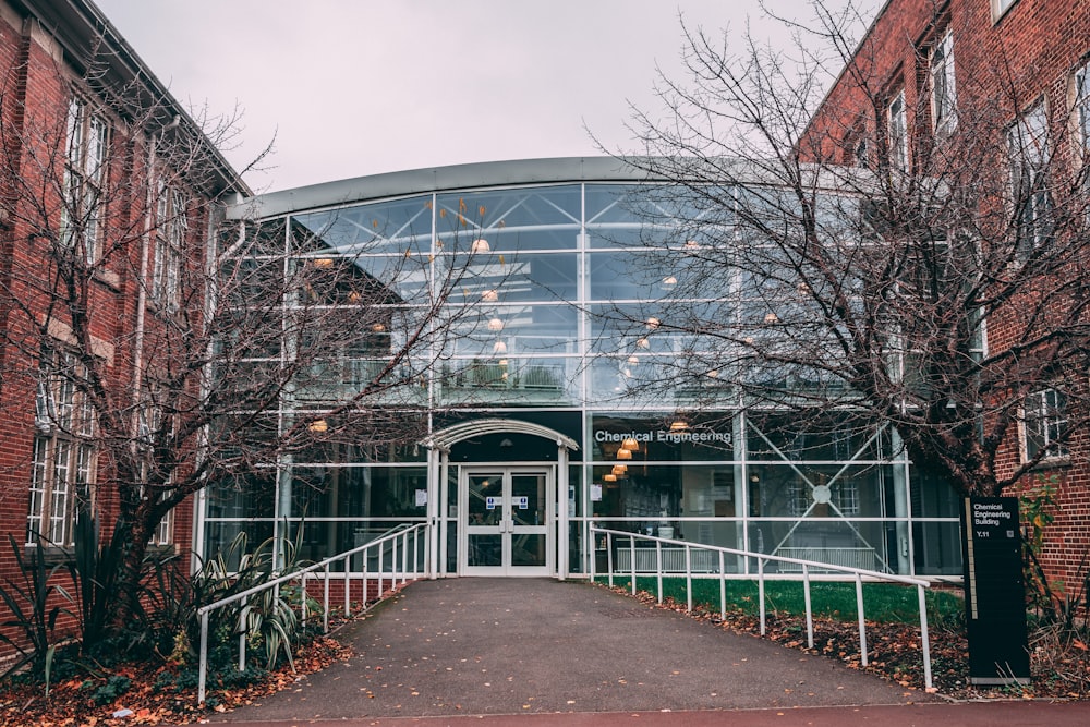 a brick building with a glass front entrance