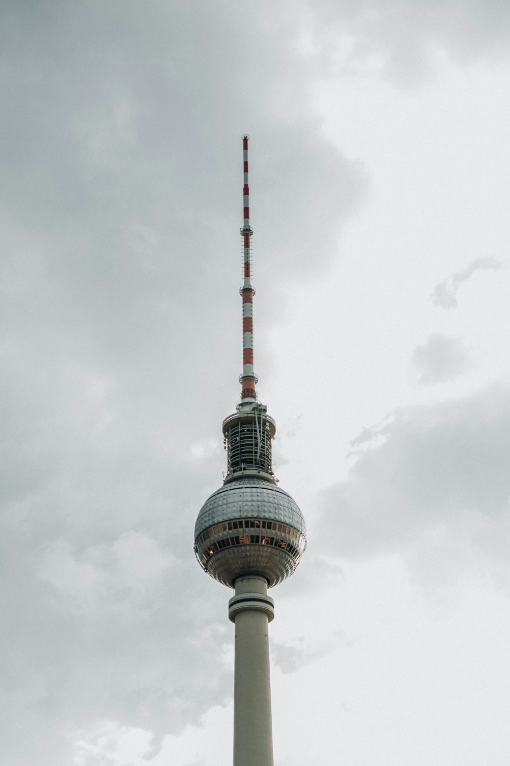 a tall tower with a red and white top