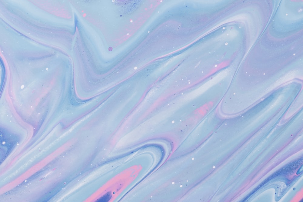 a blue and pink liquid painting with bubbles
