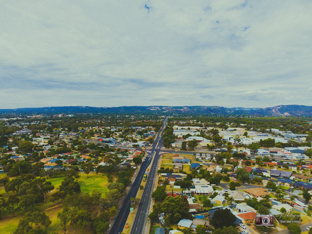 an aerial view of a city with lots of trees