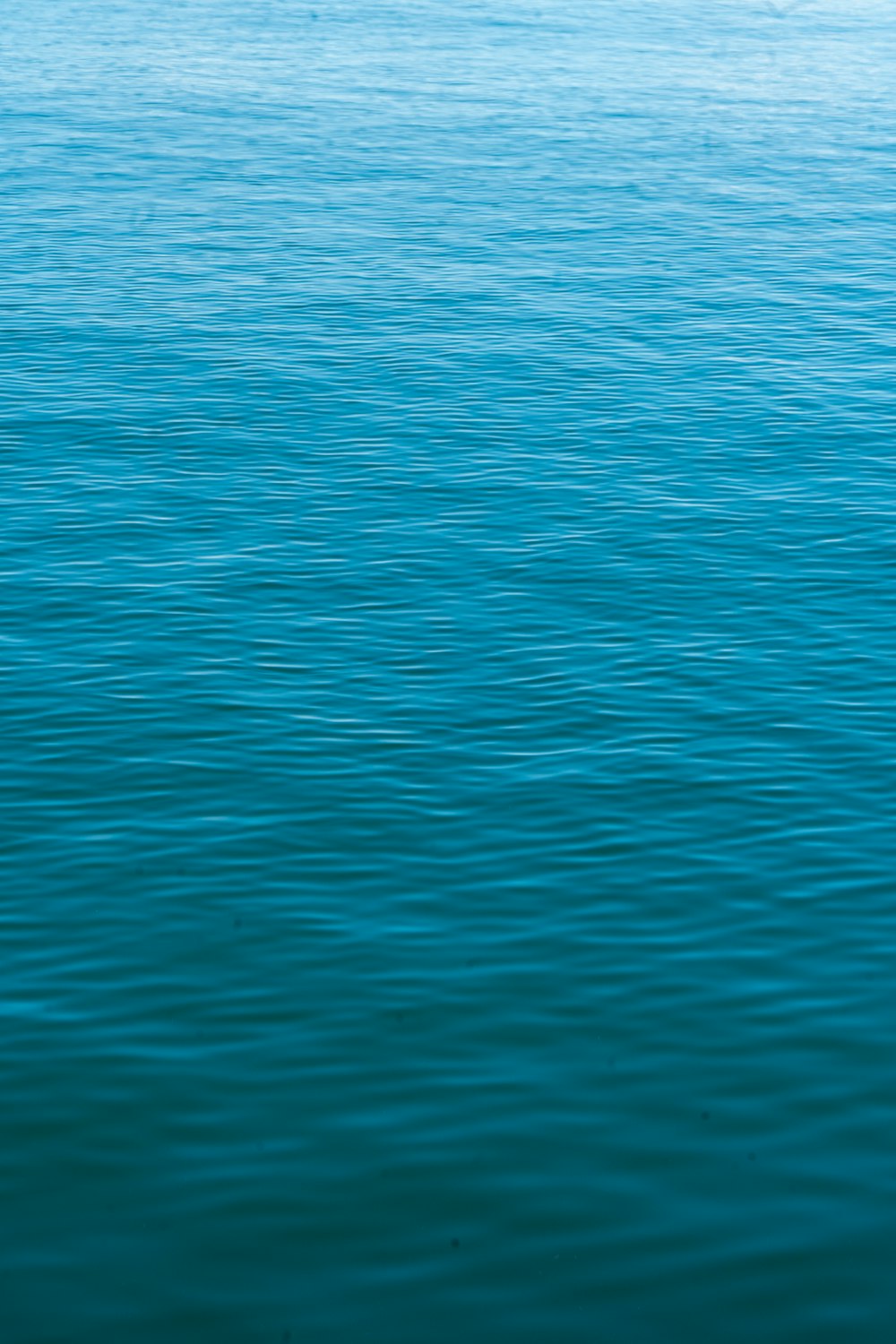 a boat floating on top of a large body of water