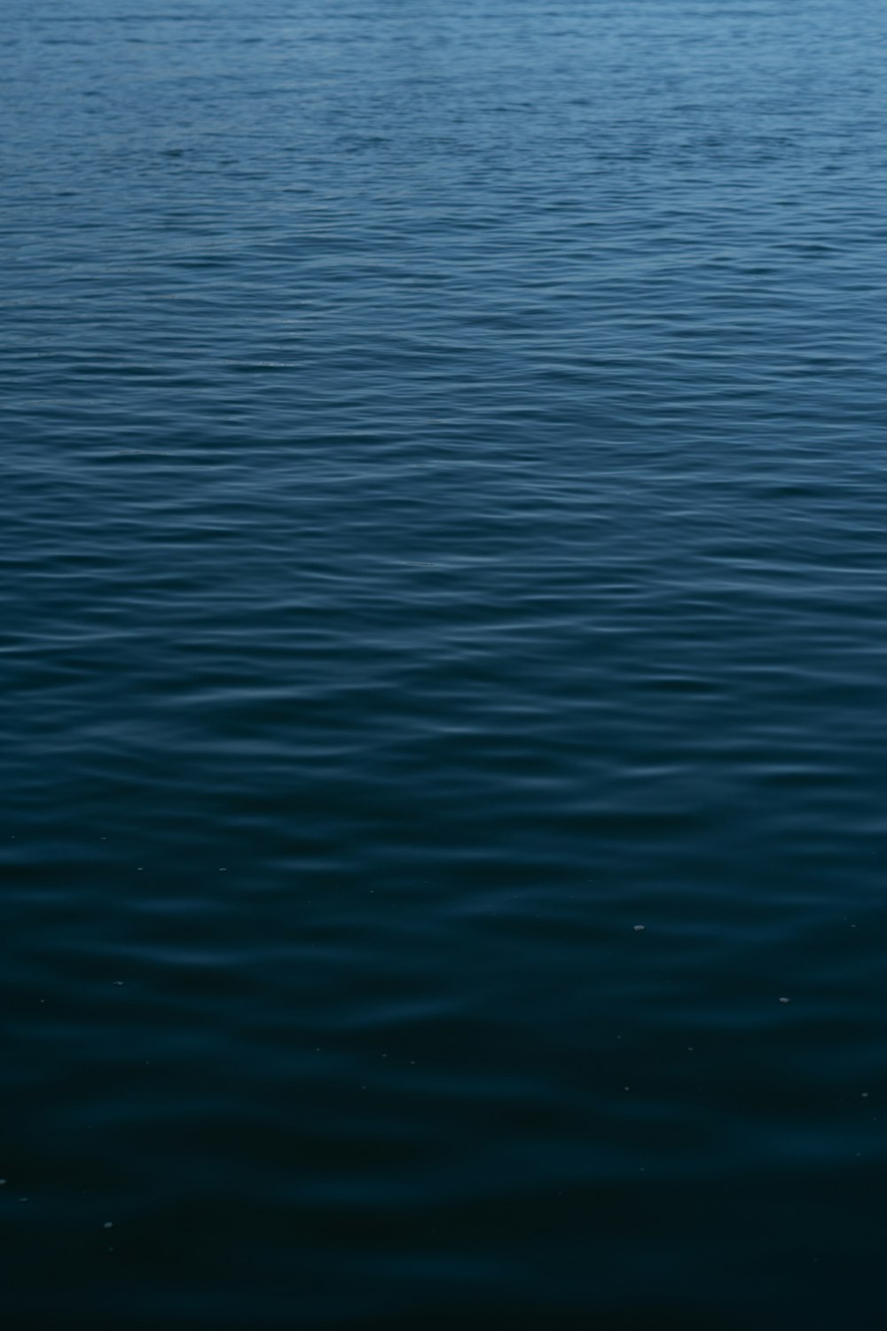 a boat floating on top of a large body of water