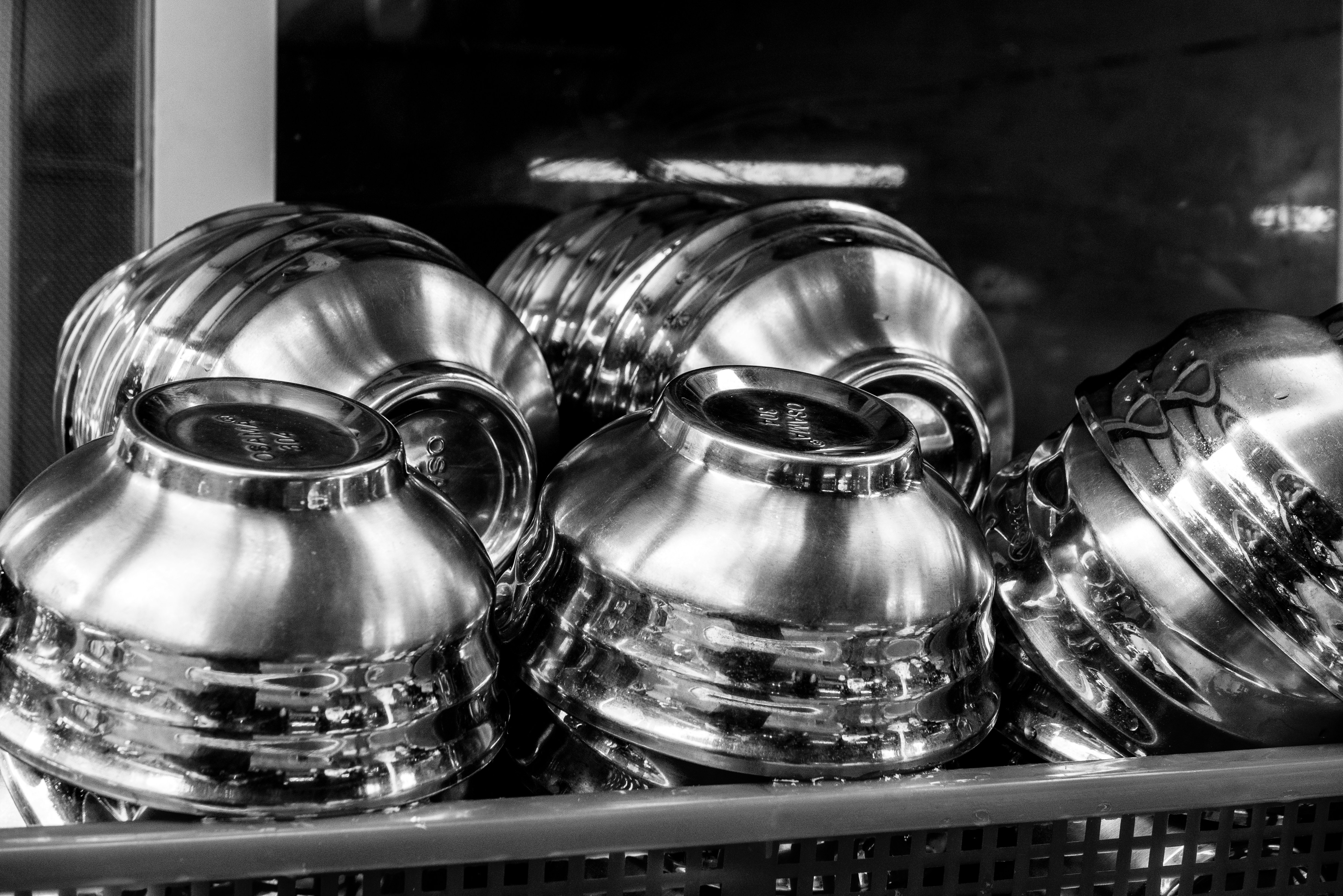 a black and white photo of pots and pans