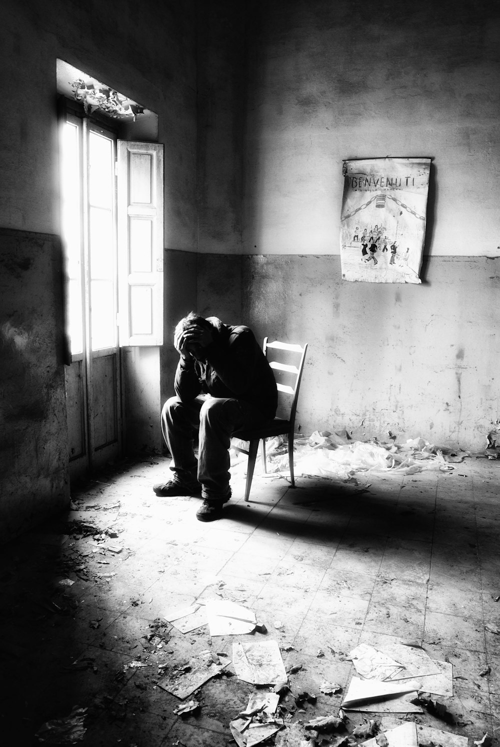 a man sitting in a chair in a room