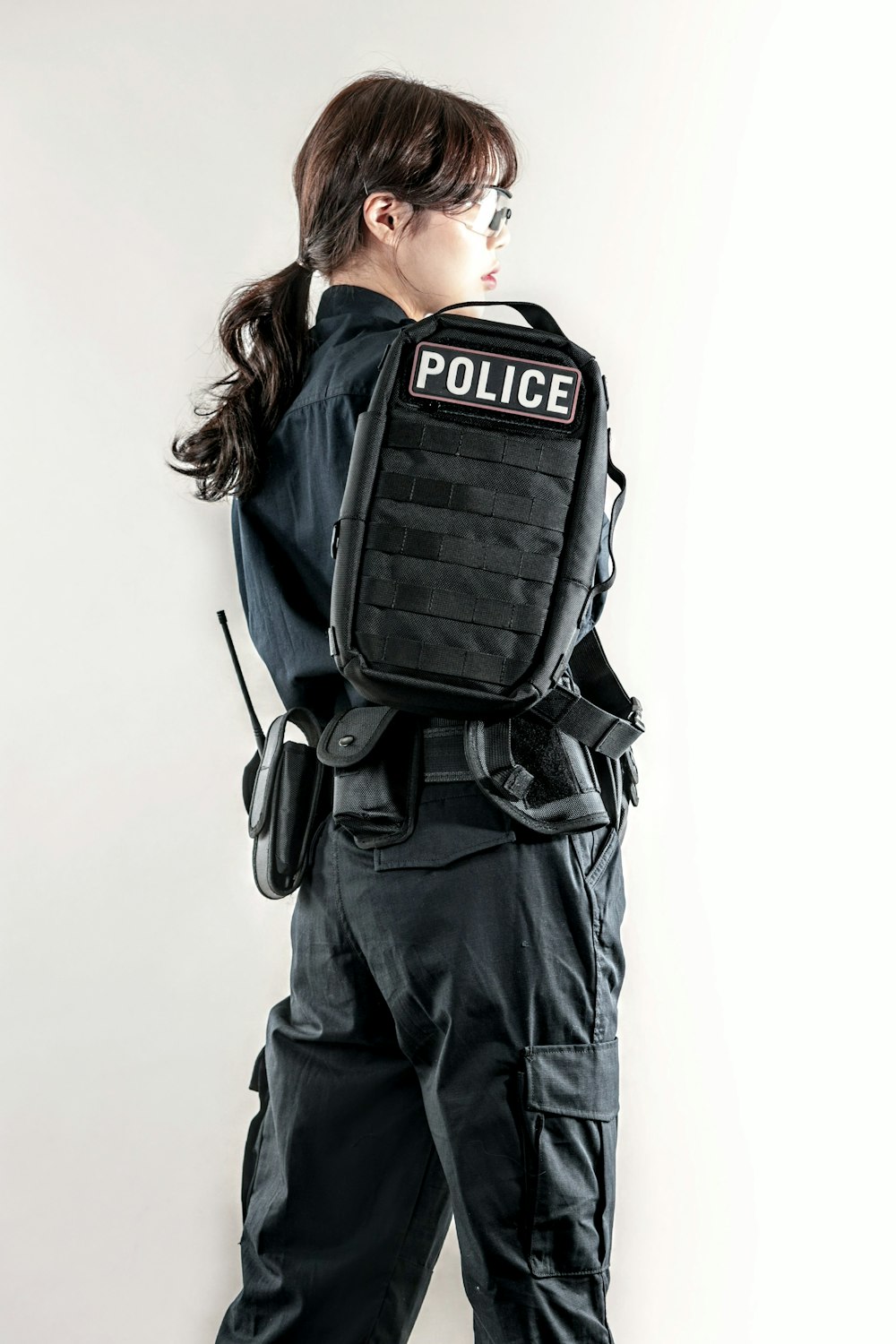 a woman in a police uniform is posing for a picture