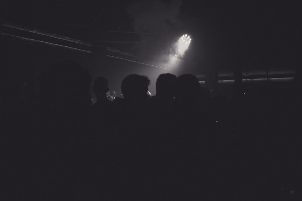 a black and white photo of a crowd at a concert