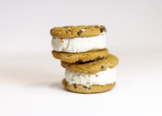 three cookies and ice cream sandwiches stacked on top of each other