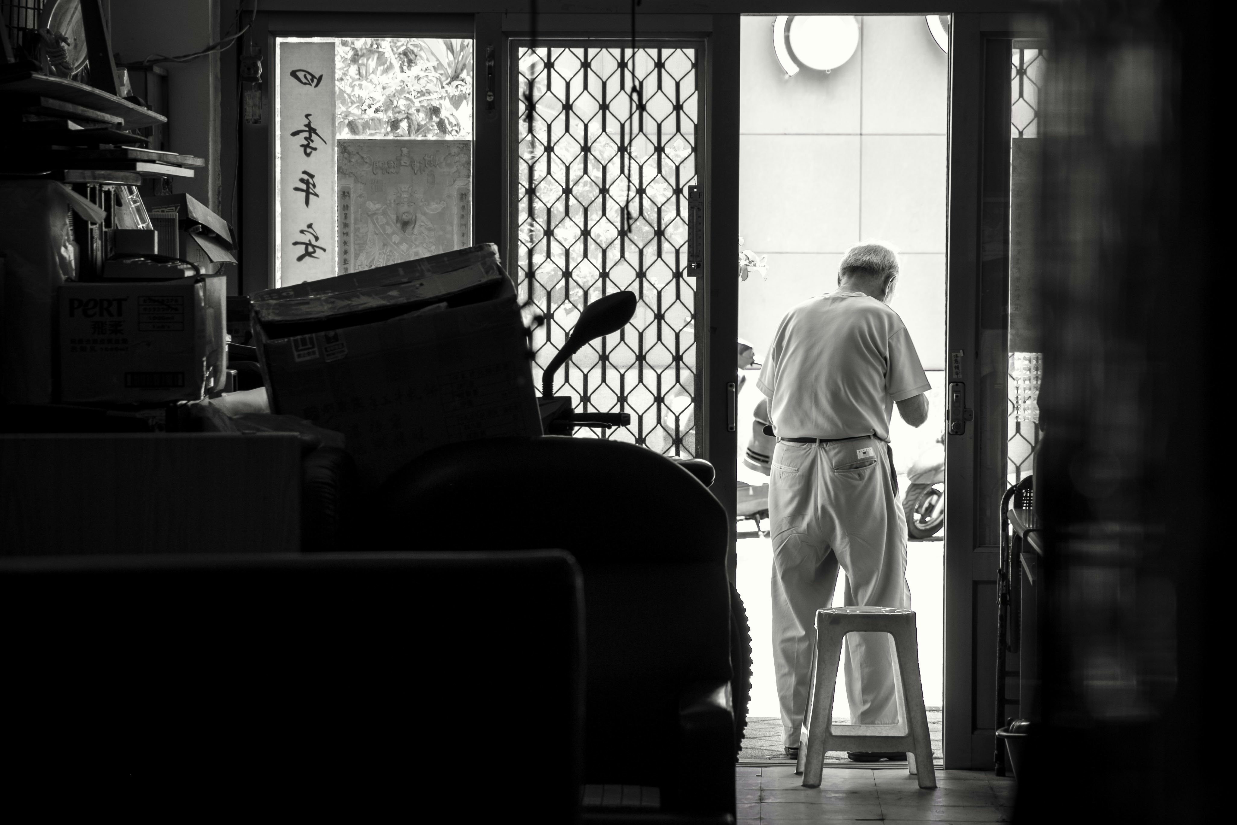 a man standing in a doorway of a house