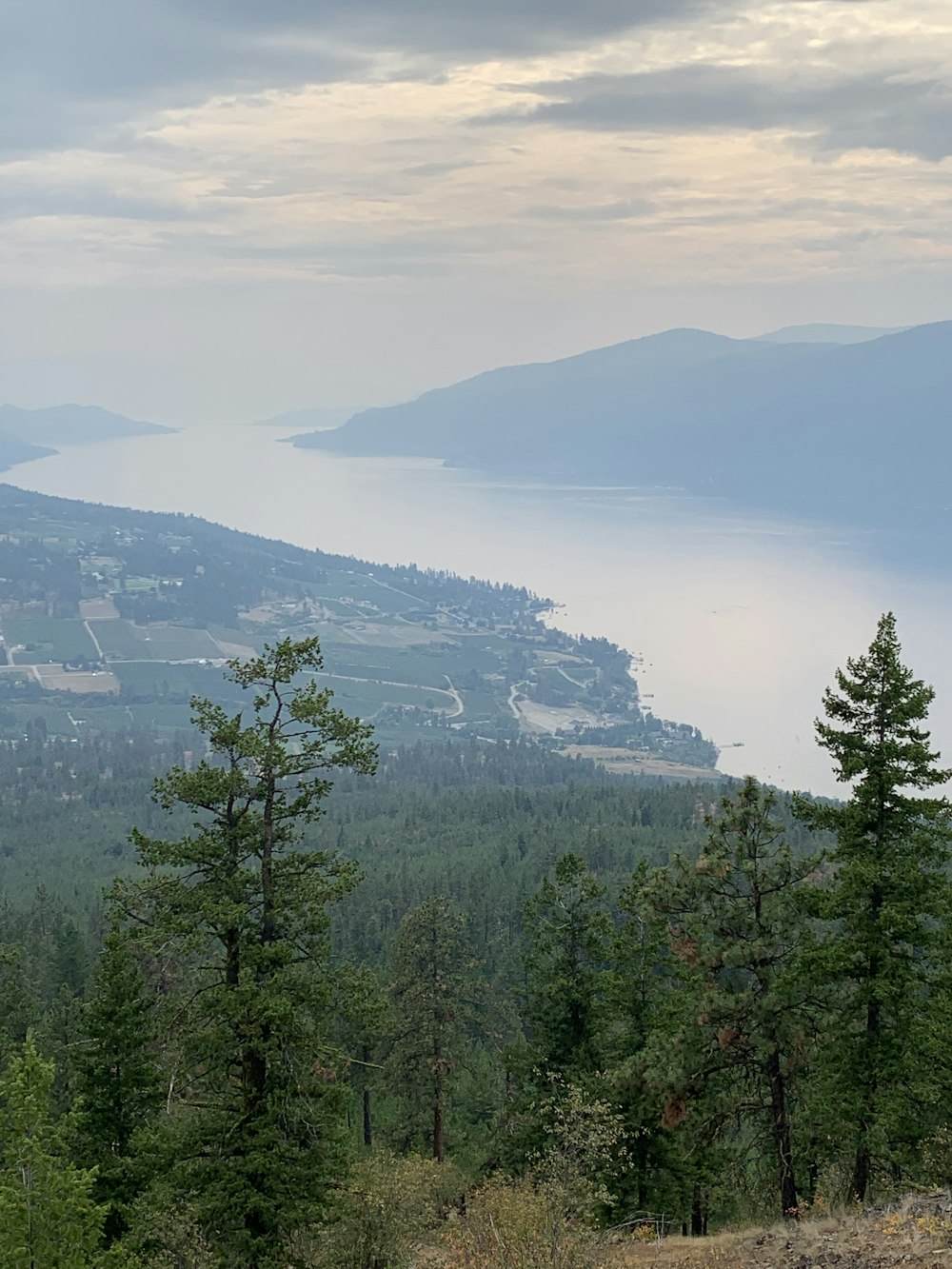 a view of a mountain with a lake in the distance