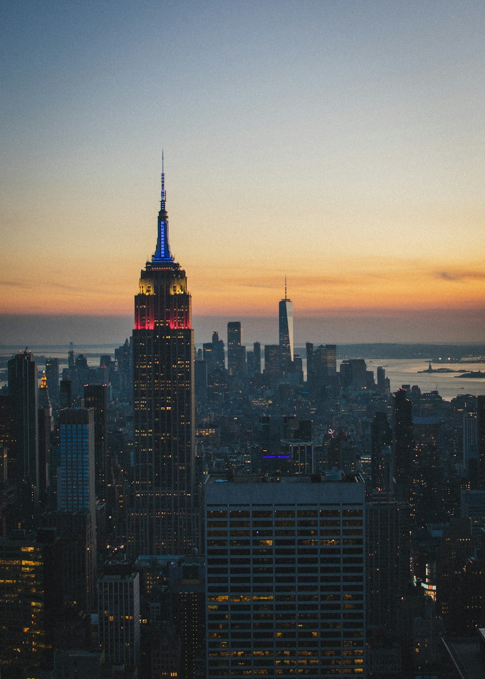 a view of a city at night from the top of a building