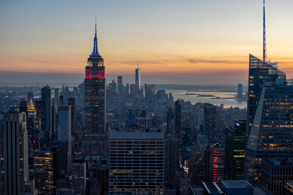 a view of a city at sunset from the top of a building