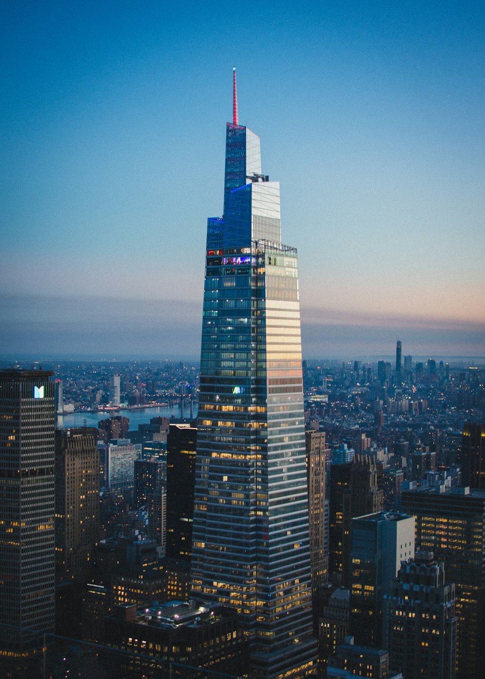 a very tall building towering over a city