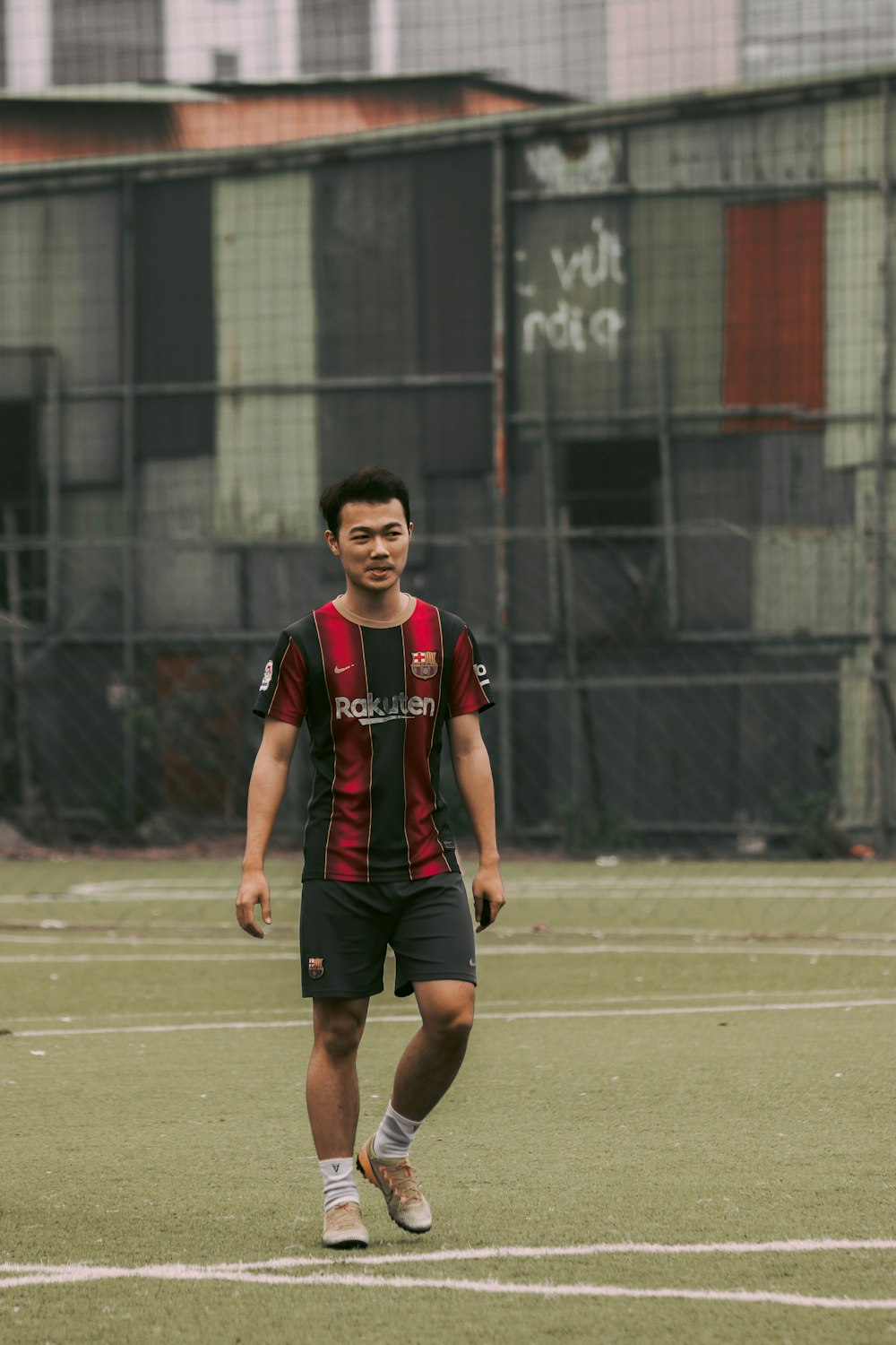 a man standing on top of a soccer field