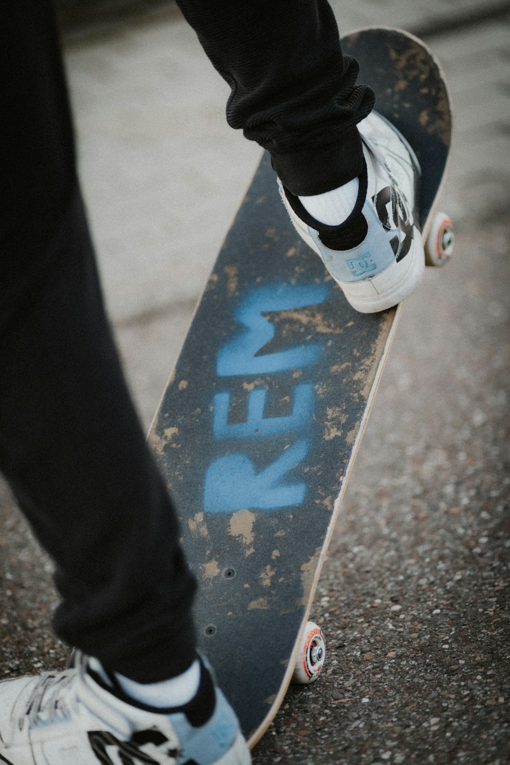 a person standing on top of a skateboard