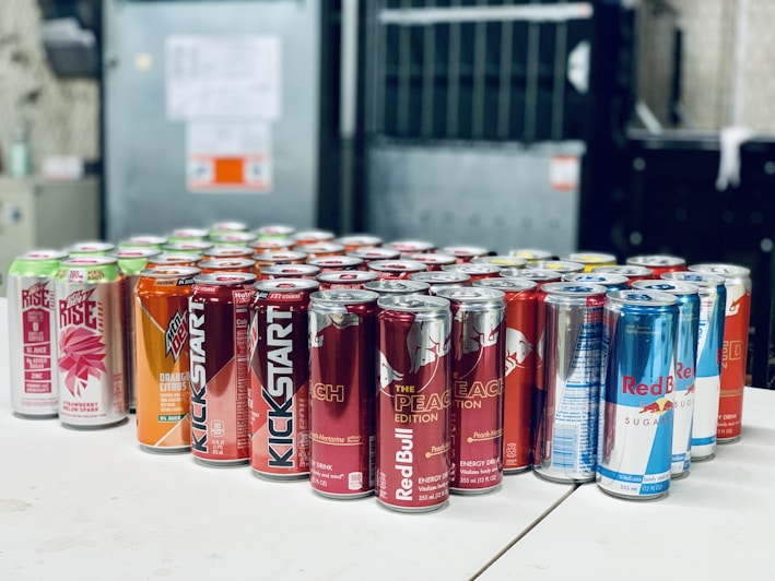 A vibrant display of various monster energy drink cans.