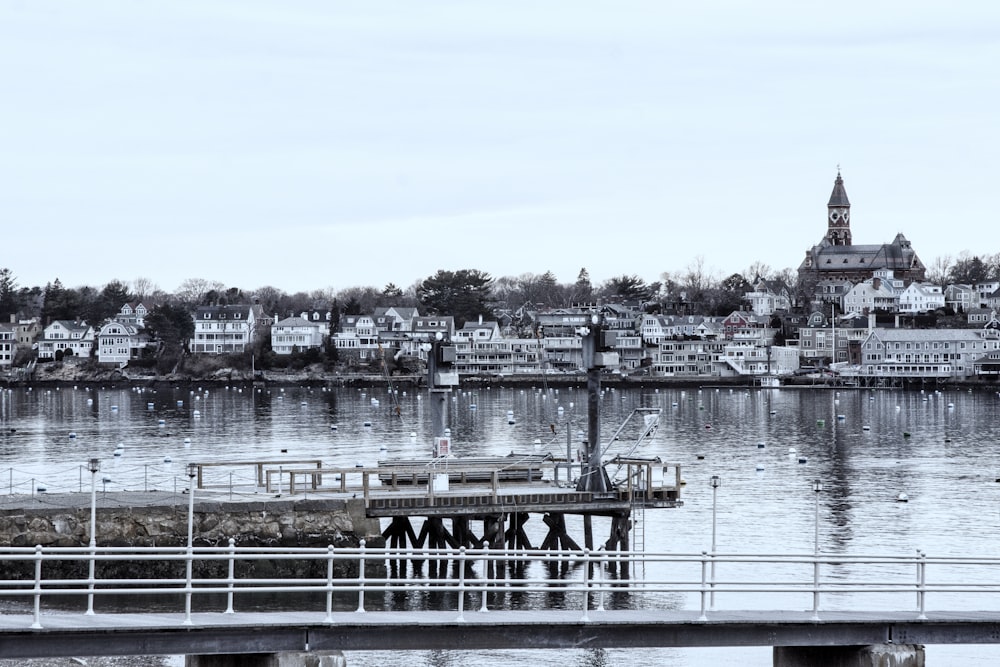 a pier with a clock tower in the background