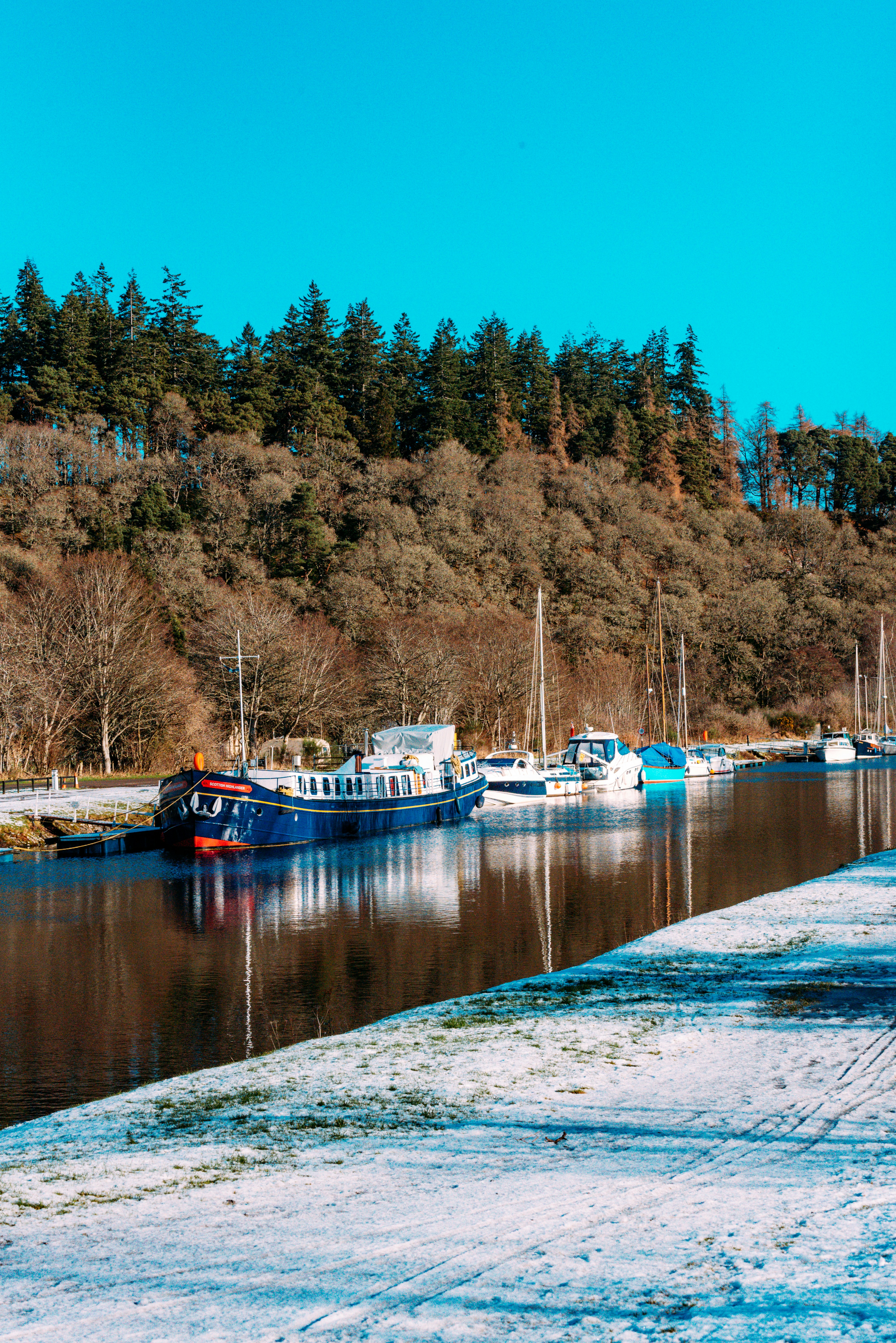 a group of boats that are sitting in the water