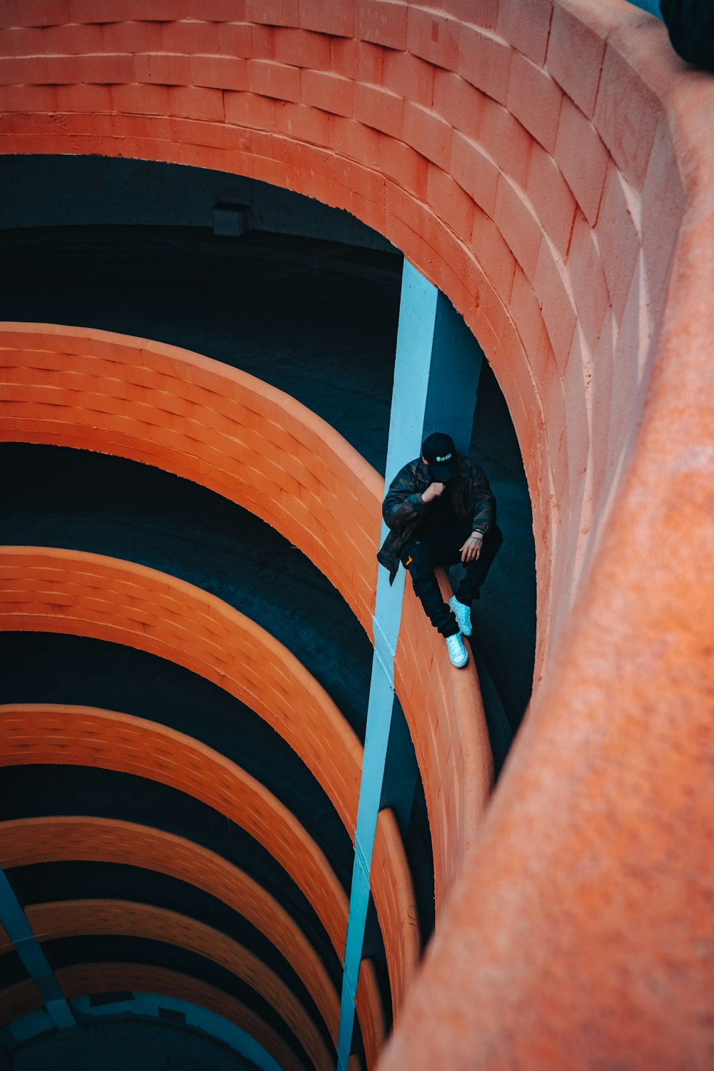 a man climbing up the side of a tall building