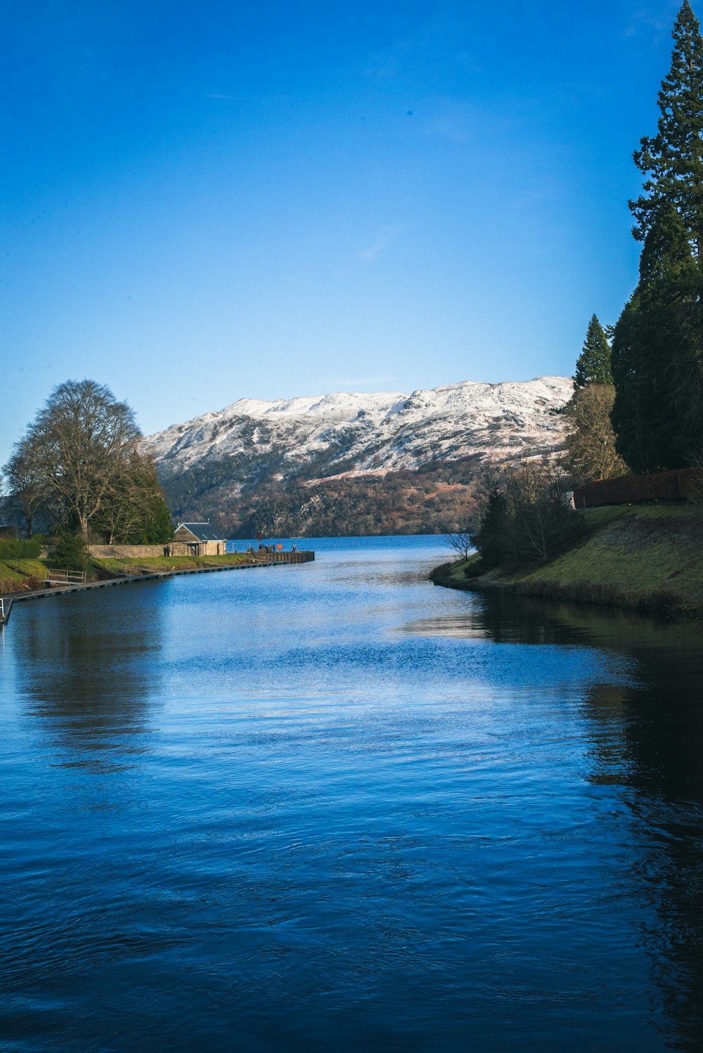 a body of water with a mountain in the background