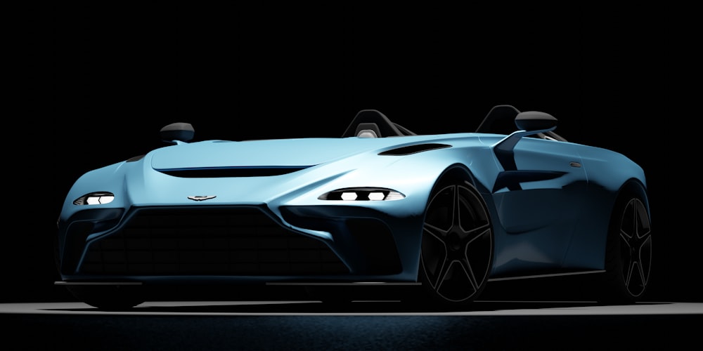 a blue sports car is shown in the dark