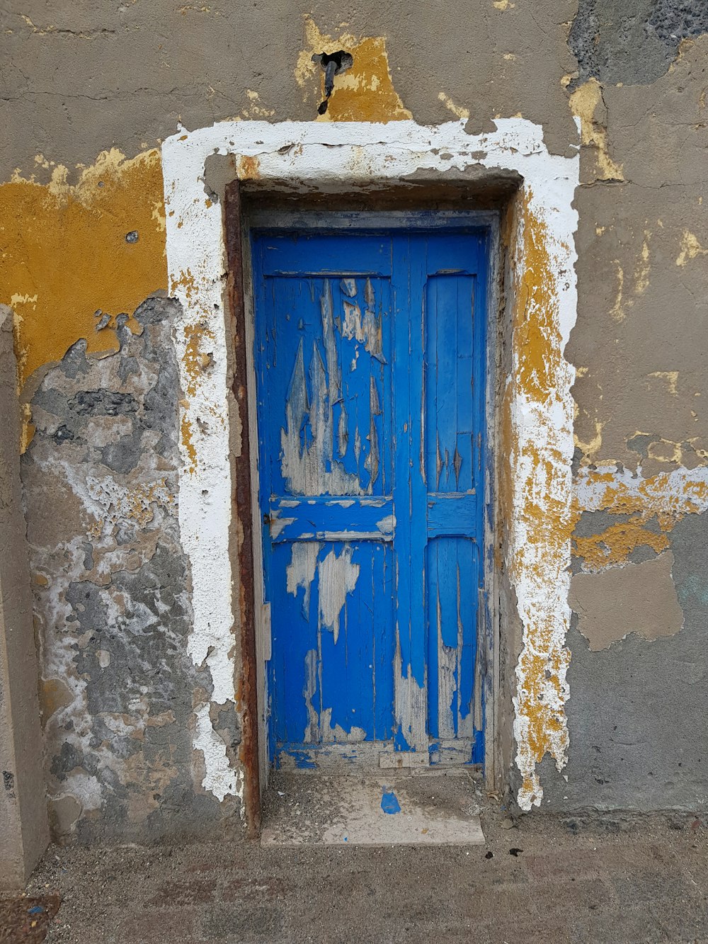 a blue door is in an old building