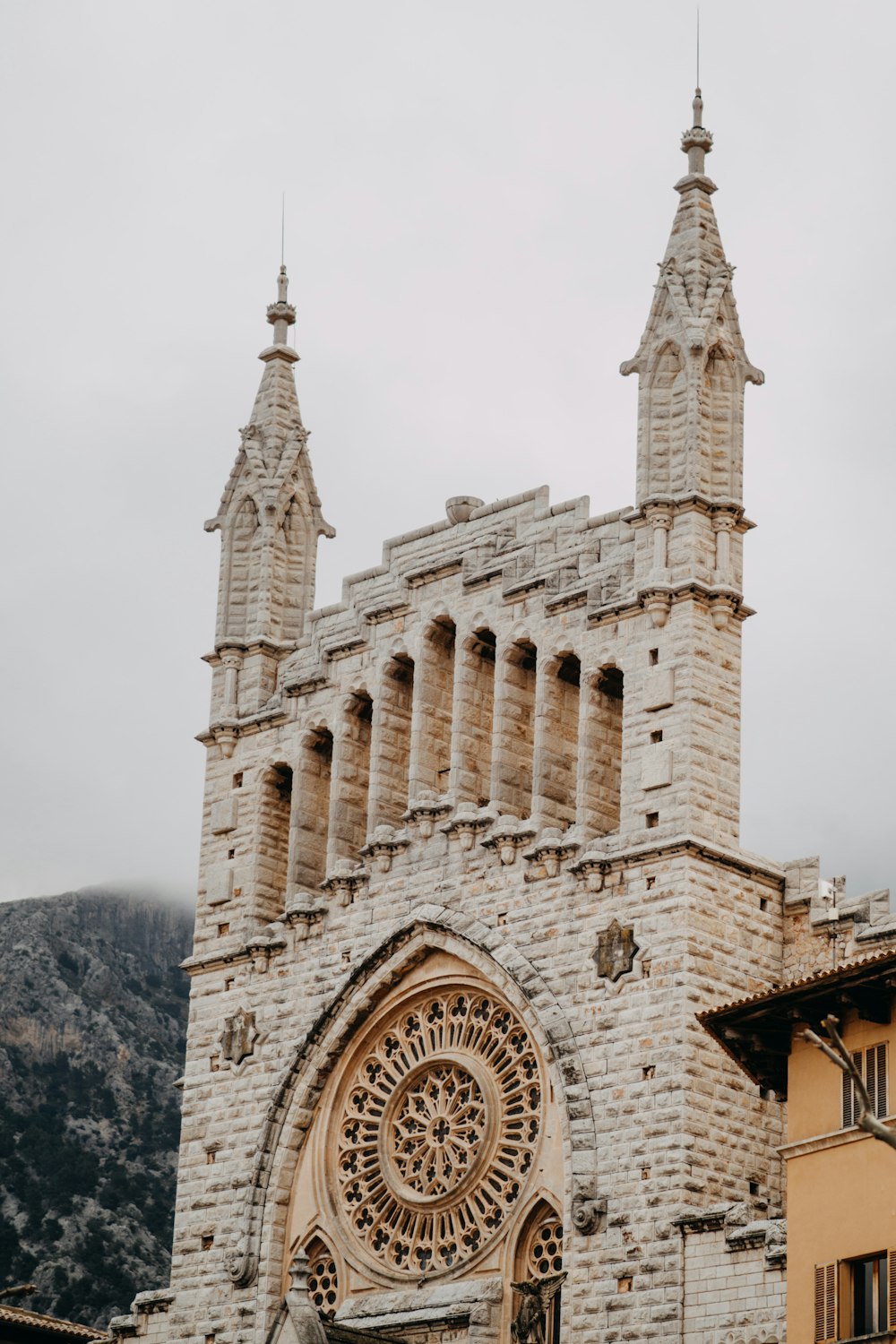 a large stone building with a clock on it's side