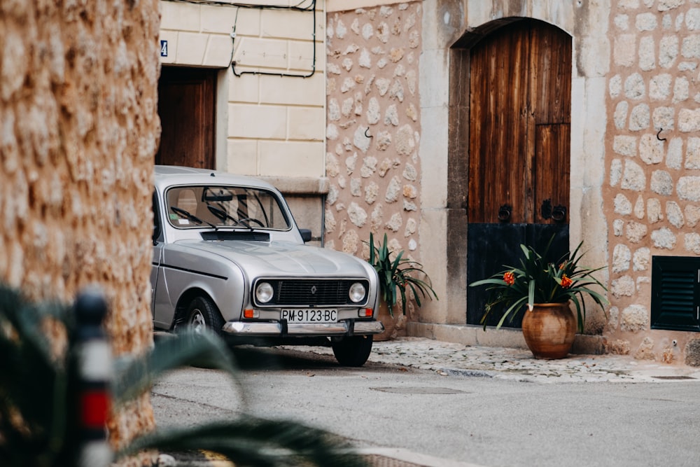 an old car parked on the side of the road