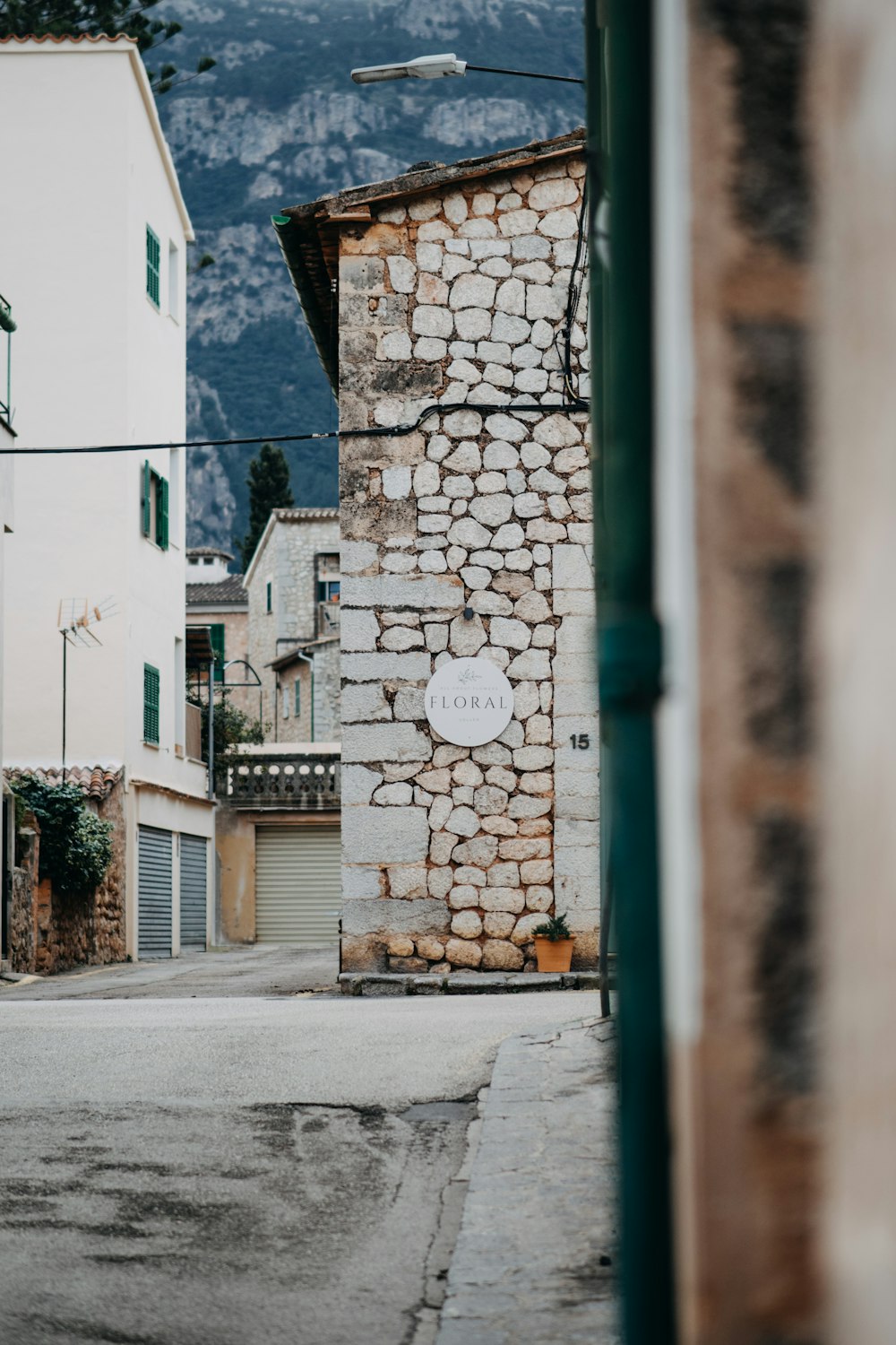 a stone building with a sign on the side of it