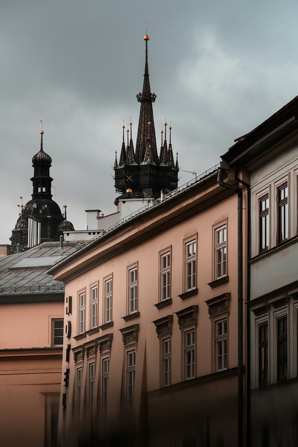 a view of a building with a clock tower in the background