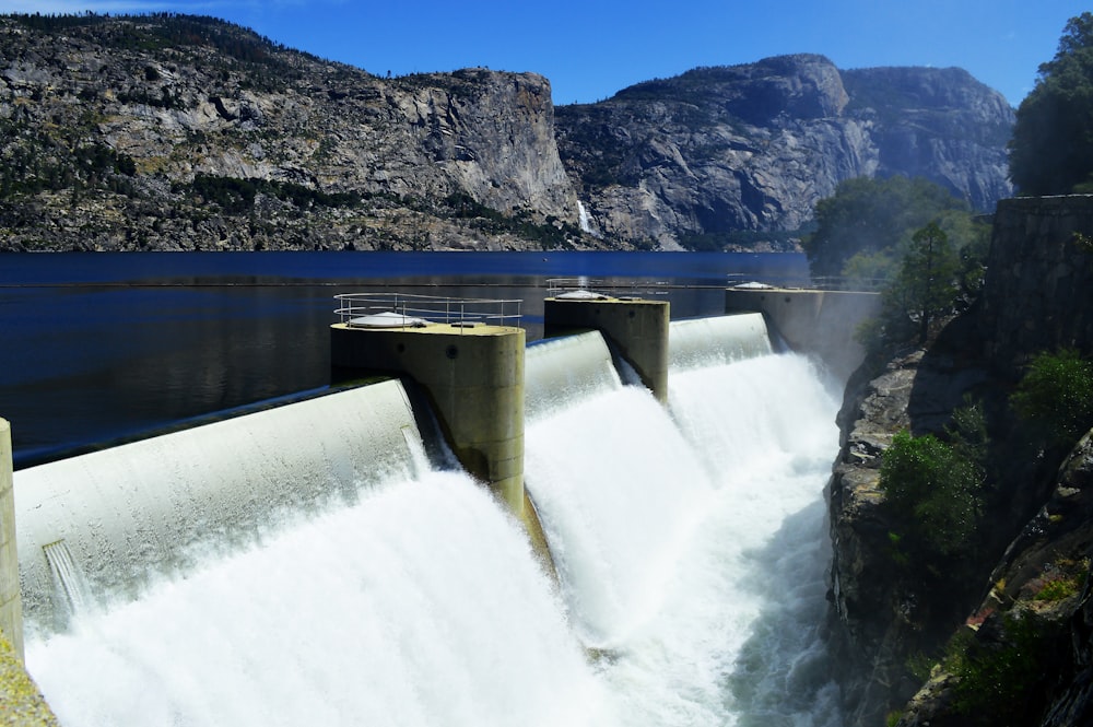 a dam with water pouring out of it