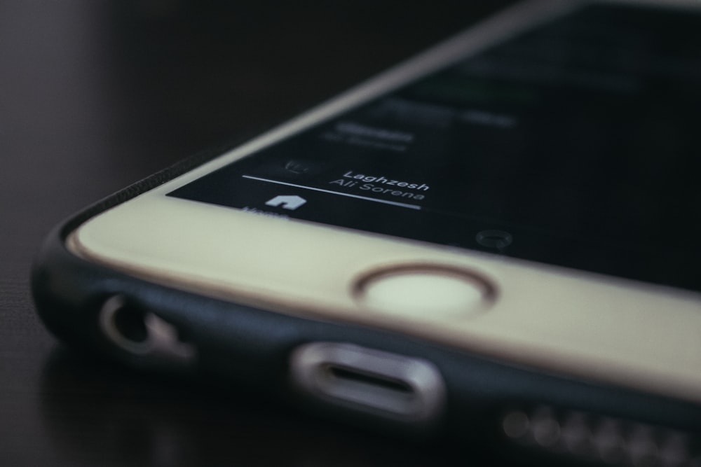 a close up of a cell phone on a table