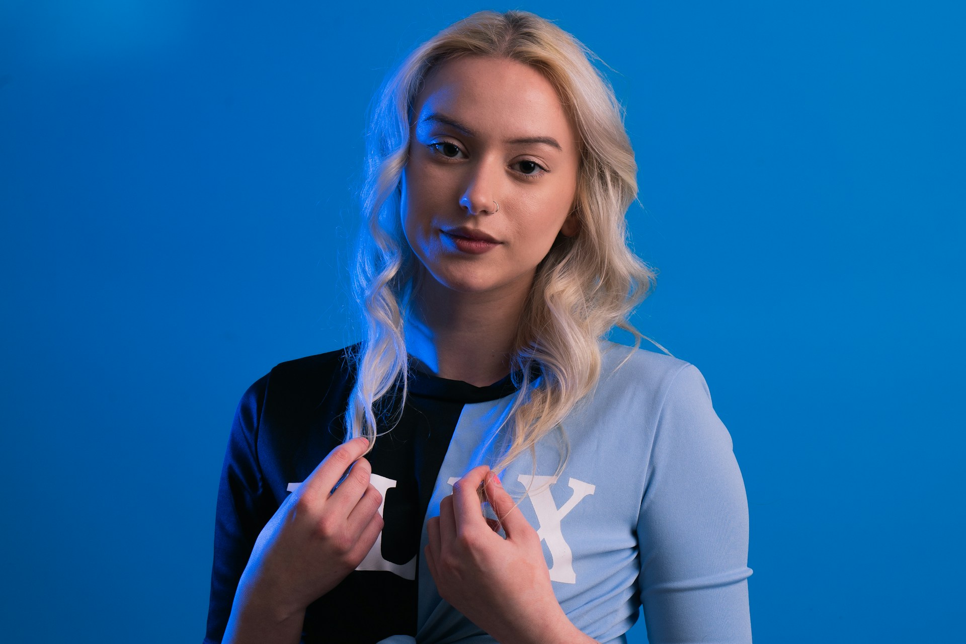 a woman holding a toothbrush in her right hand