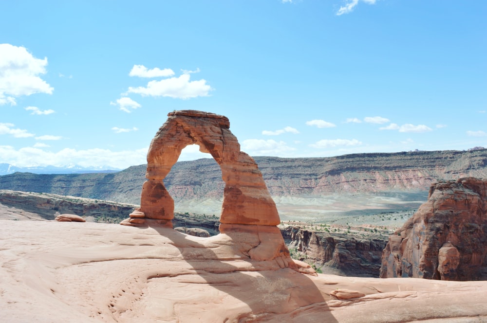 a large rock formation in the middle of a desert