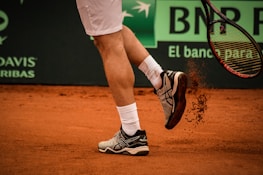 a tennis player with a tennis racket in his hand