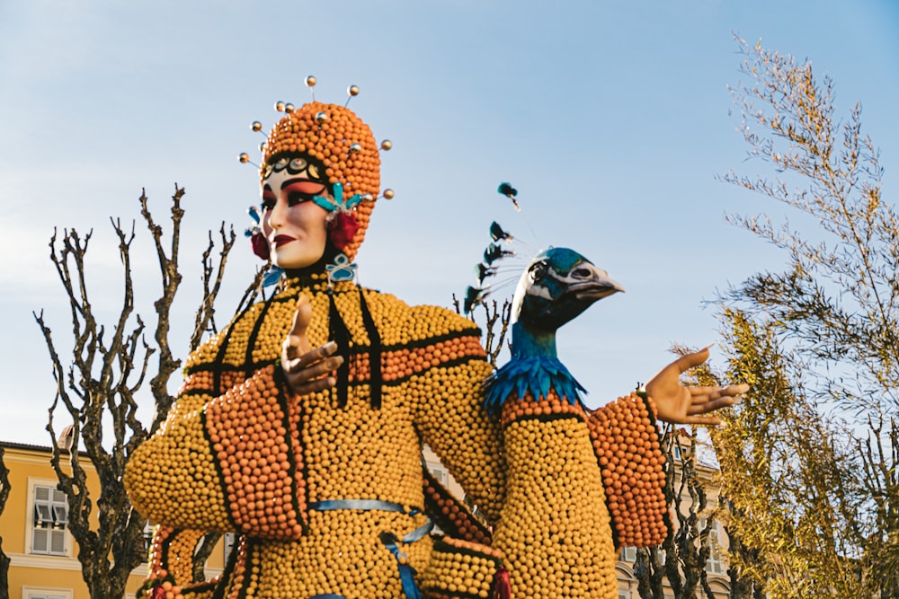 a statue of a man with a bird on his back