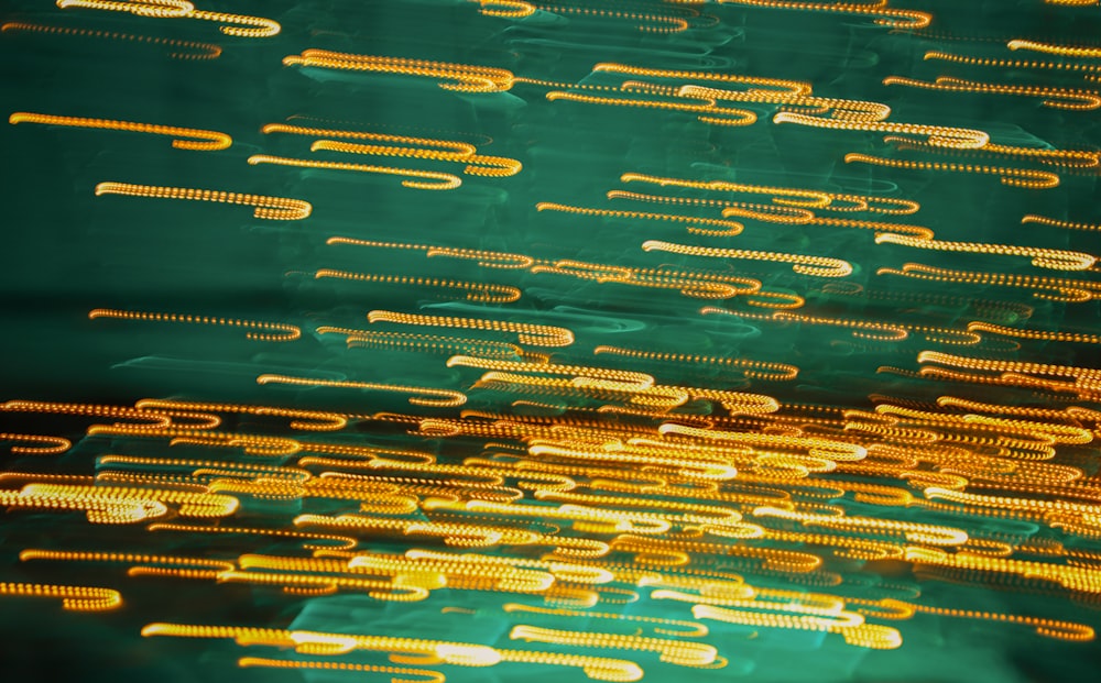 a close up of a green and yellow background