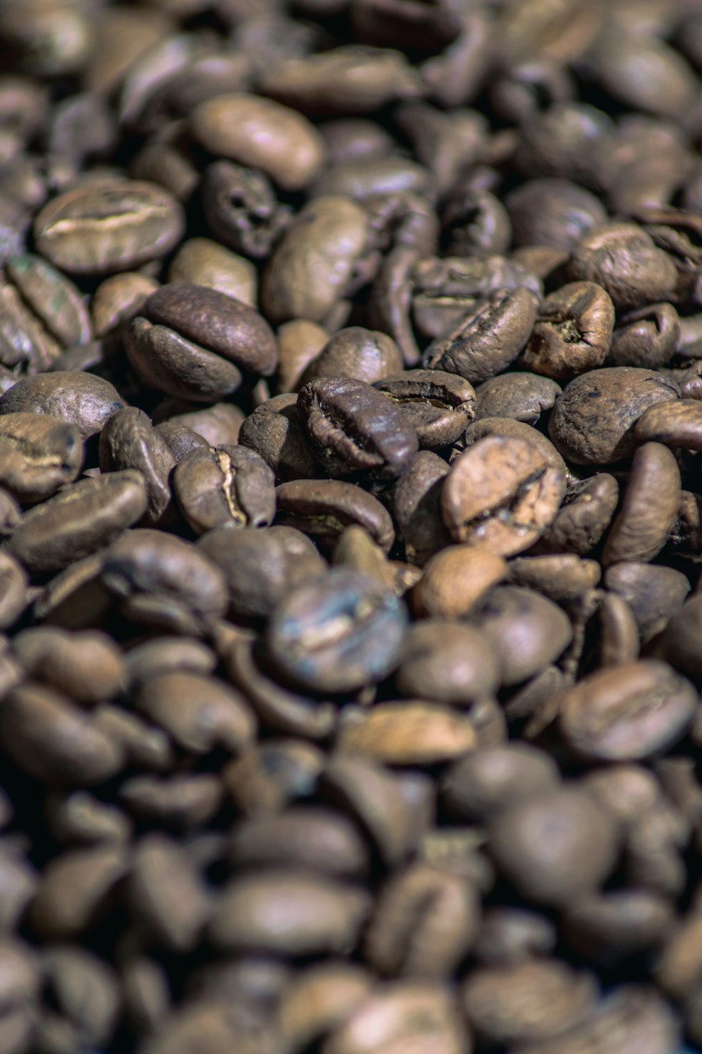 a pile of coffee beans sitting on top of each other