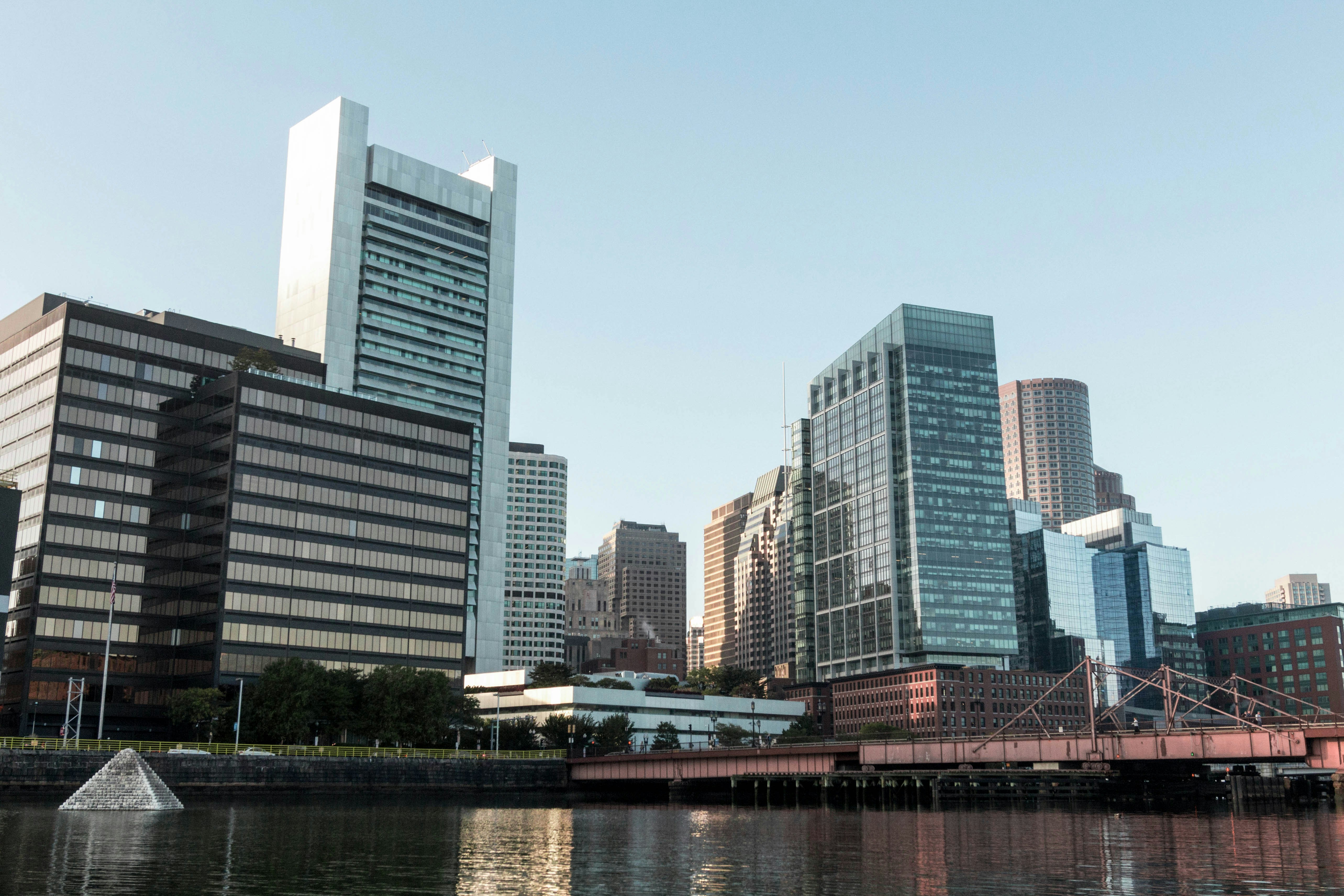 a body of water with buildings in the background
