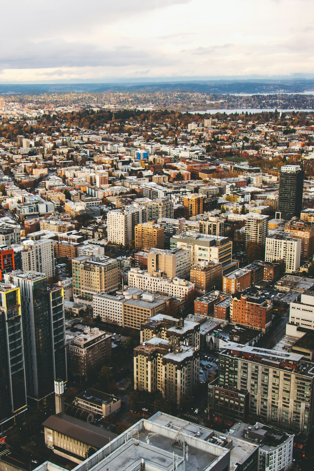 an aerial view of a city with tall buildings