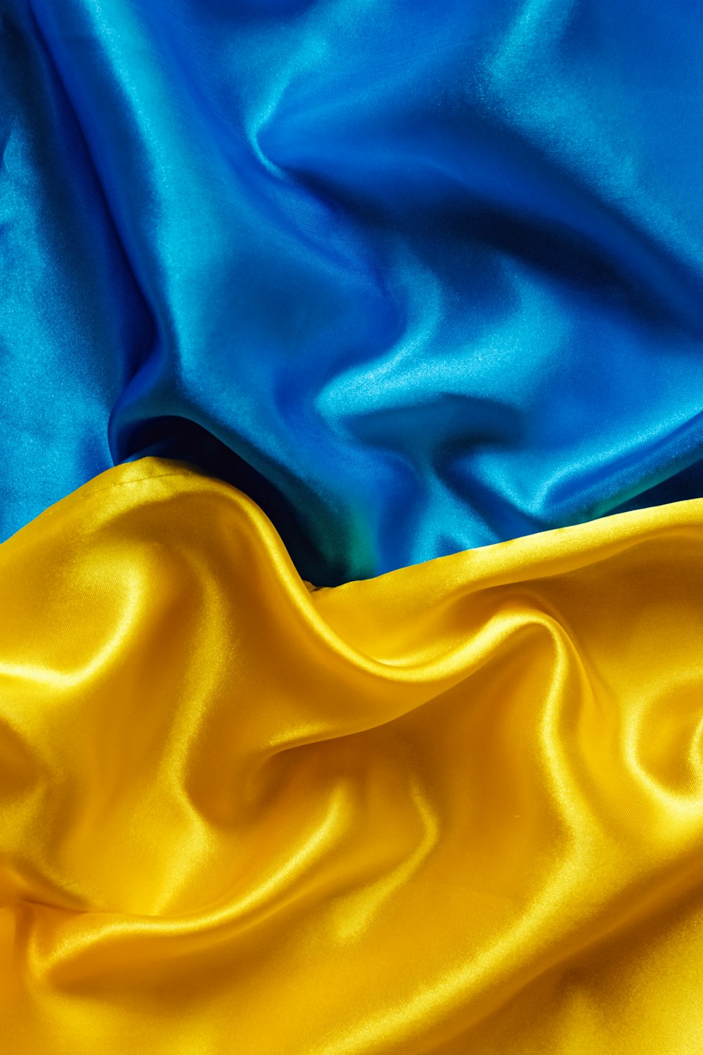 a close up of a blue and yellow fabric