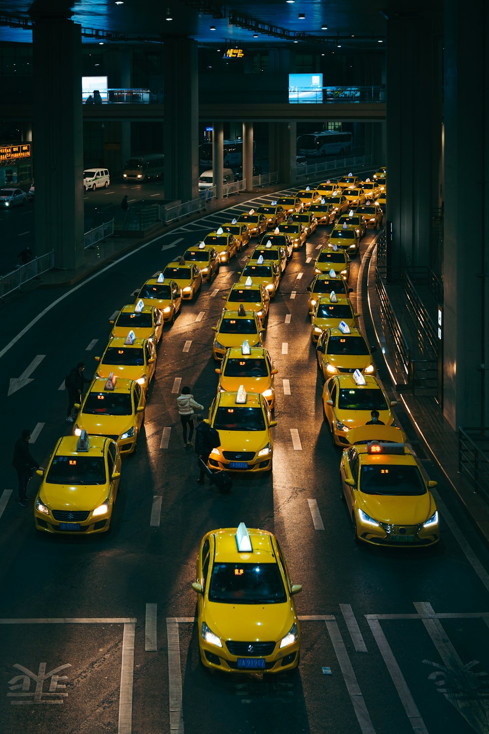 a lot of taxi cabs that are lined up
