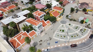 an aerial view of a town with a clock tower