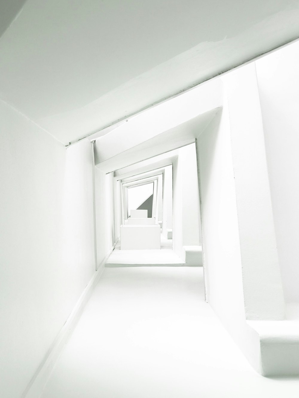 a white room with a white wall and a black and white clock