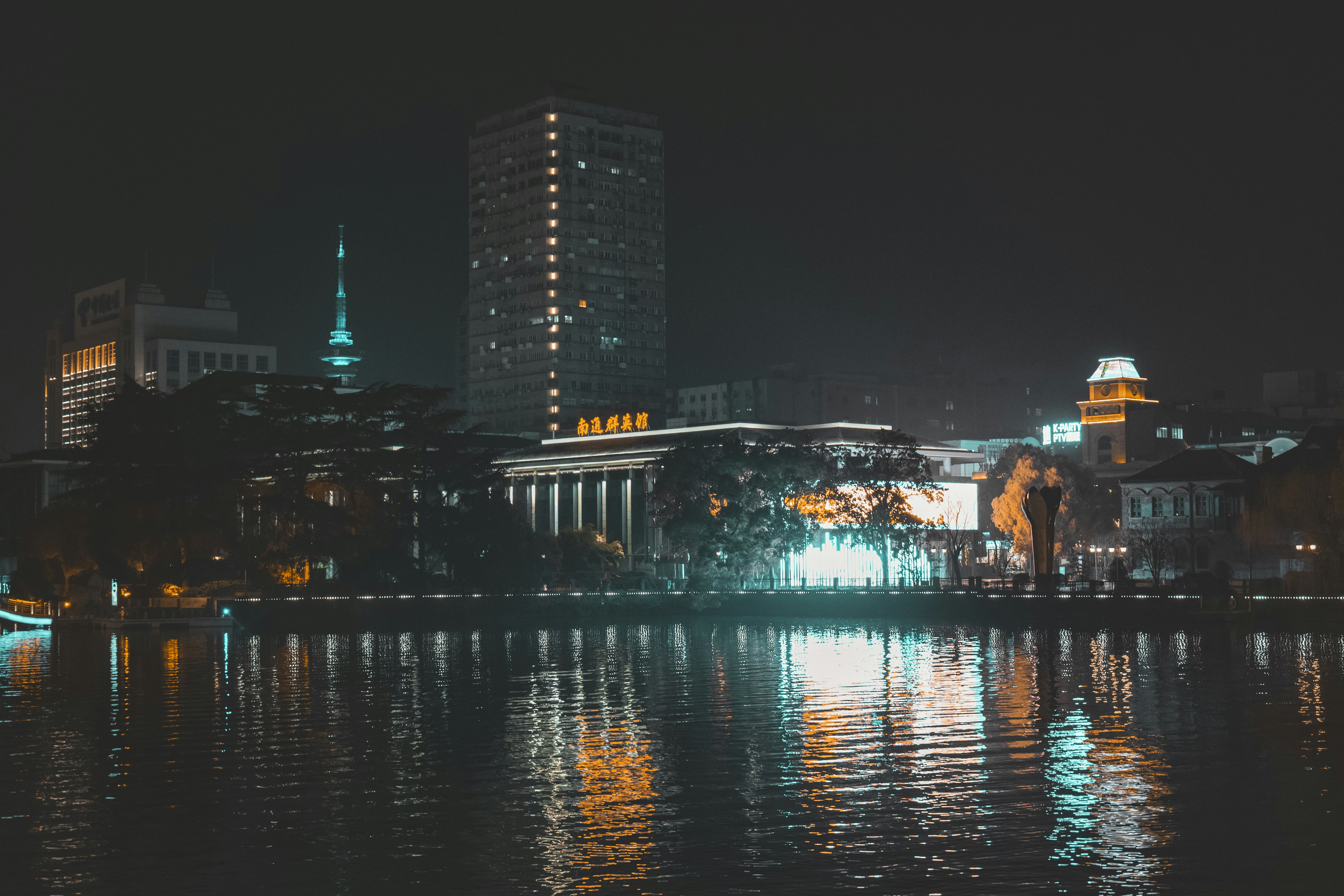 a large body of water with a city in the background