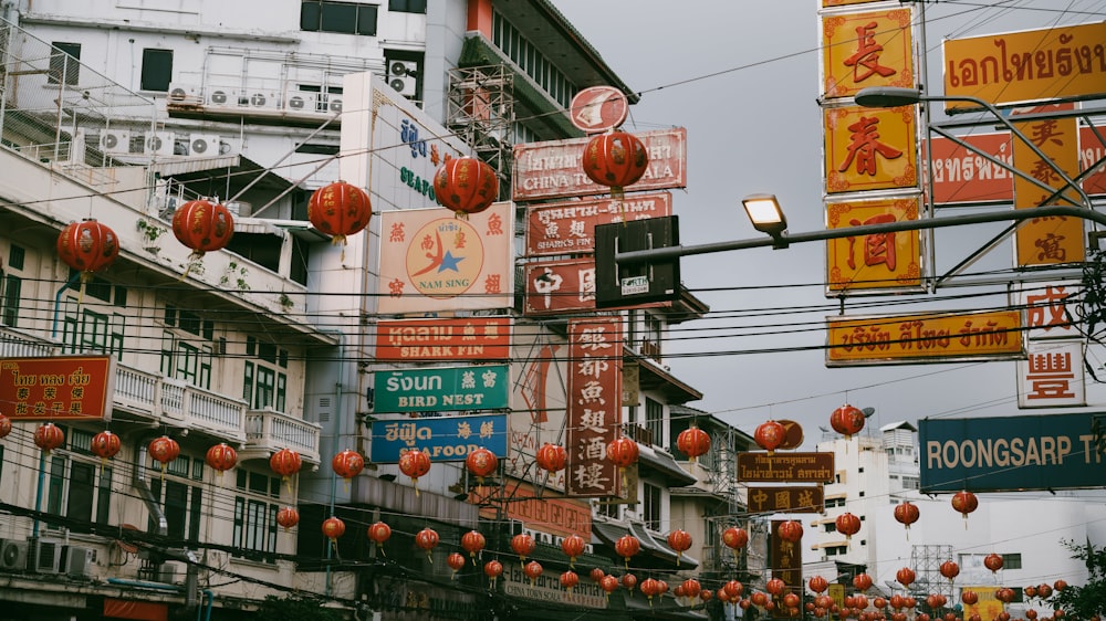 a city street filled with lots of red and yellow signs